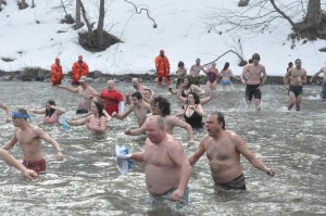Hearty swimmers return from the west bank of the Brandywine after braving the 35-degree water.